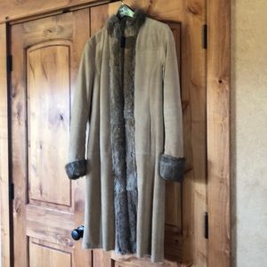 Beautiful mid length leather coat with fur trim